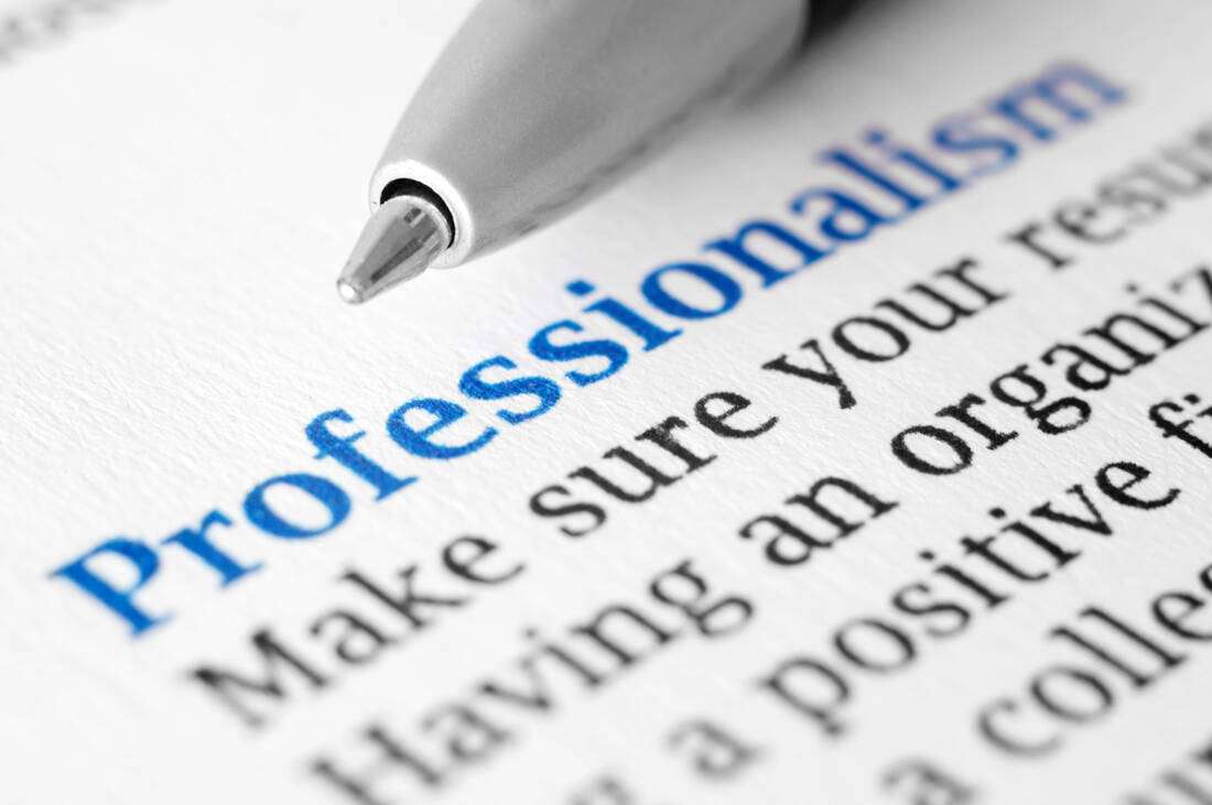 The word Professionalism printed on a page with a pen
