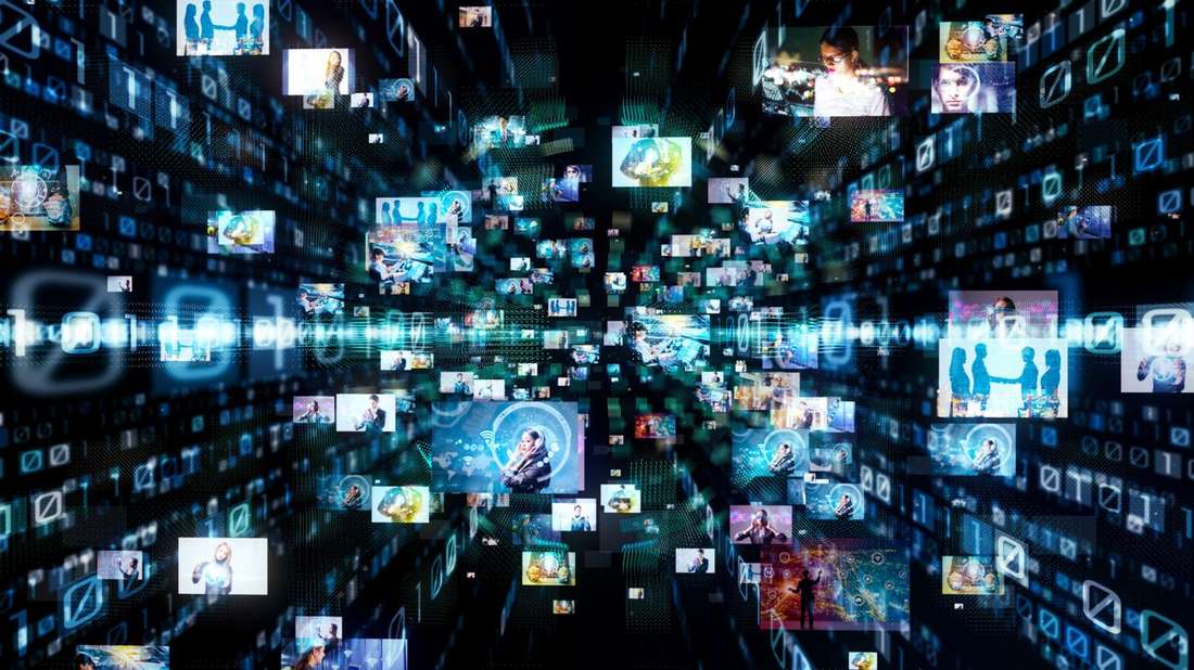 Streams of digital images and screens rushing through a dark tunnel of light